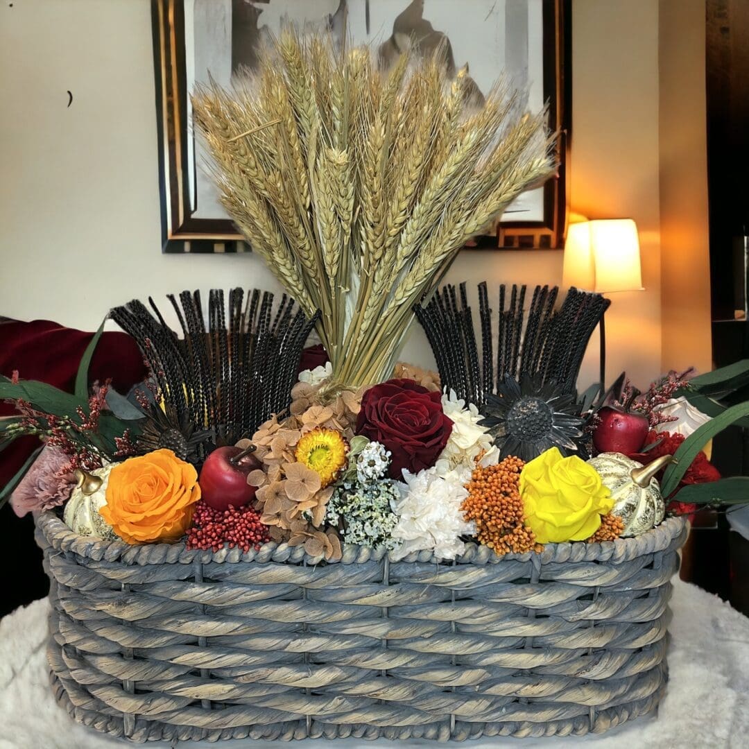A basket of flowers on top of a table.