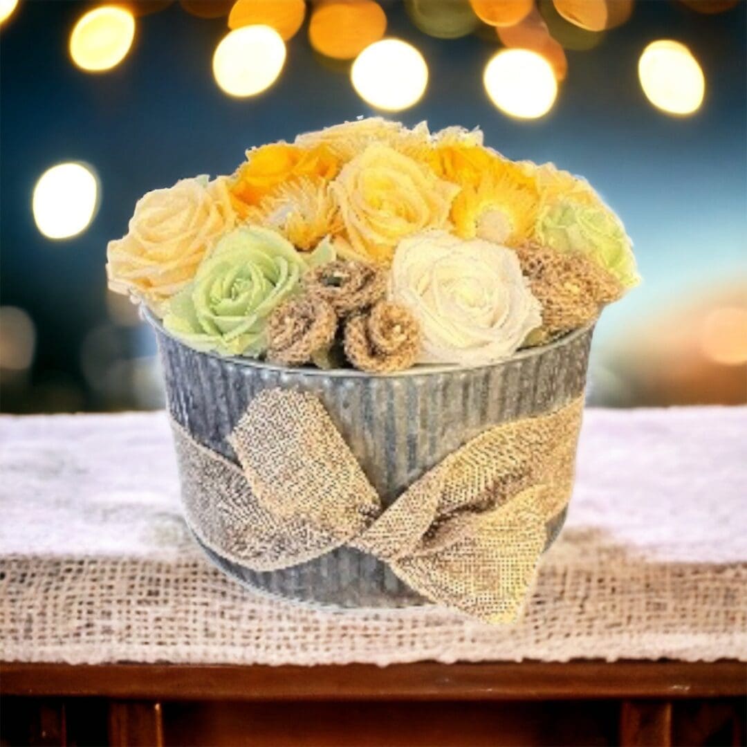 A bouquet of flowers in a vase on a table.